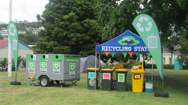 Mobile recycling trailer with bins